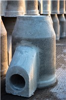 Road gullies, which require a hinged grating on top are designed to collect surface water. Because of the high outlet position, the gully collects any silt or debris as the water flows via the gully outlet into the drainage pipe. Gully sumps must then be periodically cleaned out.